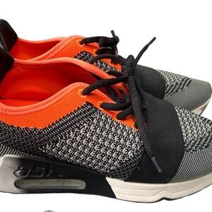 Dynamic Black and Orange Sneakers with Air Cushioning